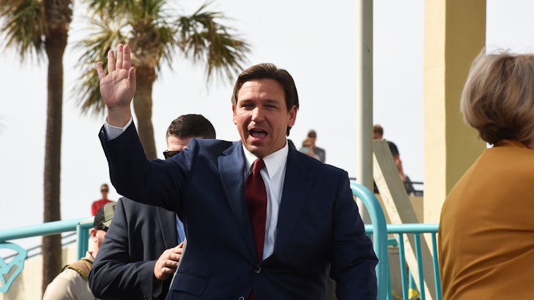 Ron DeSantis waves and has his mouth open