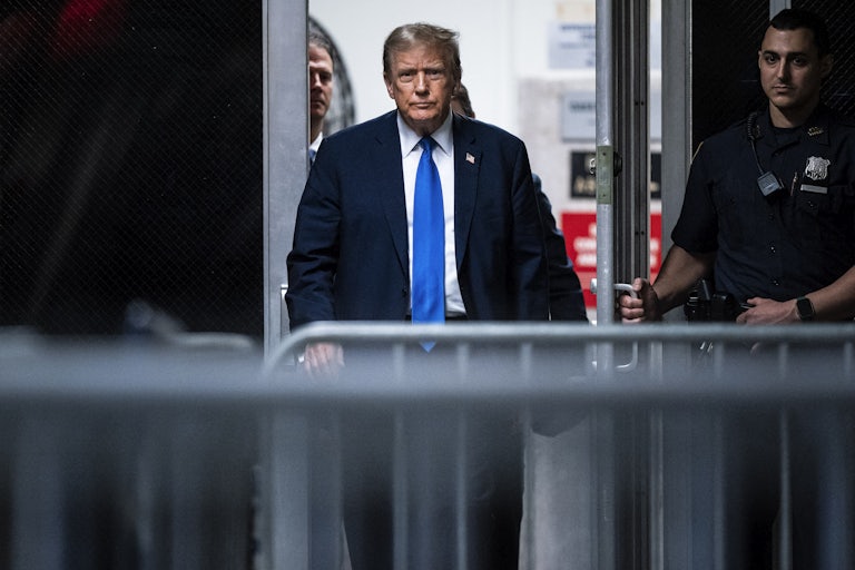 Donald Trump walks out of the Manhattan courthouse