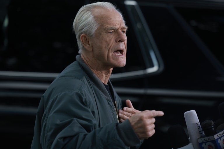 Peter Navarro yelling with a mic in front of him