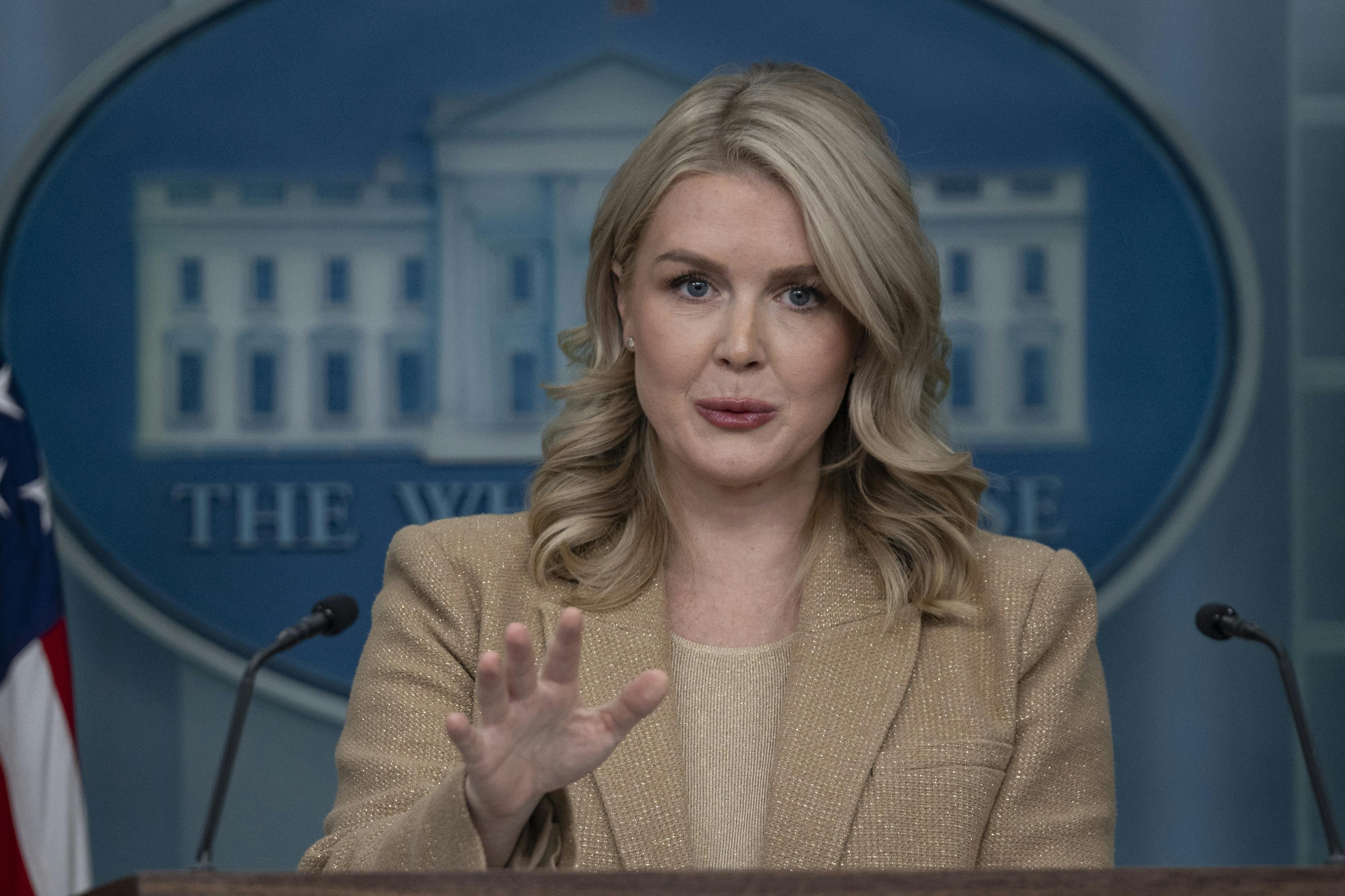 White House press secretary Karoline Leavitt gestures while speaking at a podium