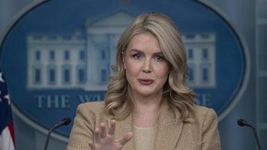 White House press secretary Karoline Leavitt gestures while speaking at a podium