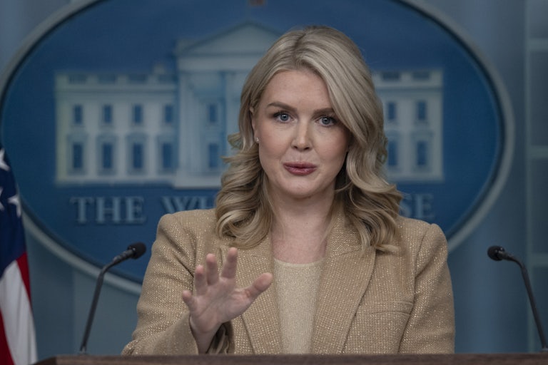 White House press secretary Karoline Leavitt gestures while speaking at a podium