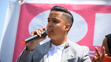 Alderman of Chicago's 26th Ward Jessie Fuentes speaks on a microphone while at a rally.