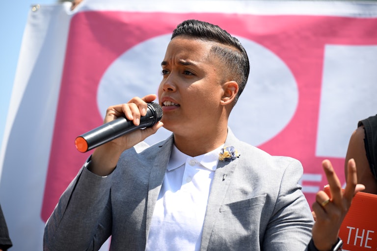Alderman of Chicago's 26th Ward Jessie Fuentes speaks on a microphone while at a rally.