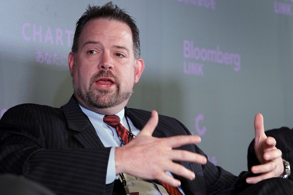 Brian Heywood gestures while talking while seated.