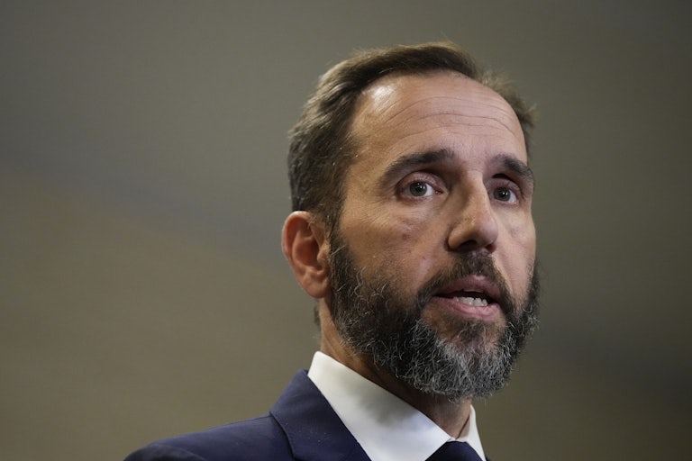 Jack Smith looks to the side while speaking