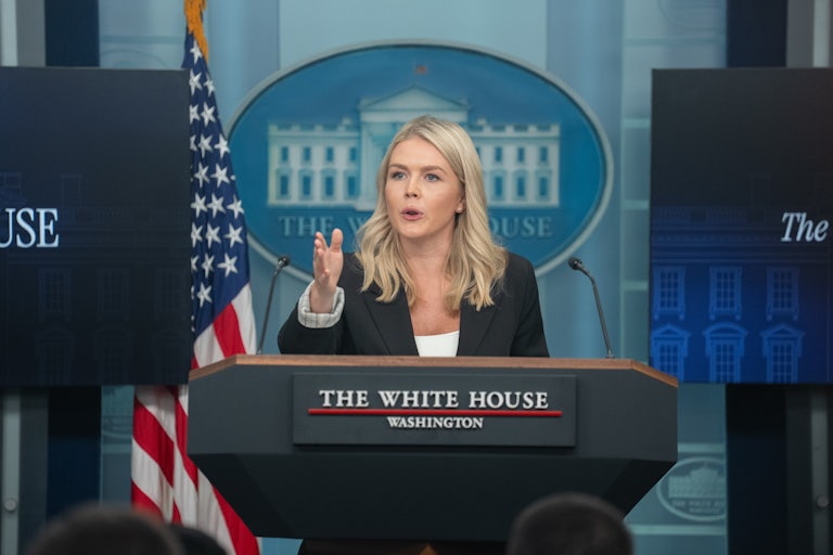 White House press secretary Karoline Leavitt gestures while speaking at the podium during a press briefing
