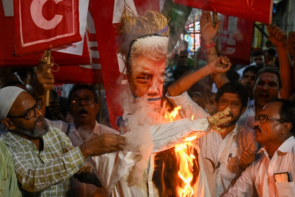 Trade union activists in Kolkata, India, burned an effigy of Trump