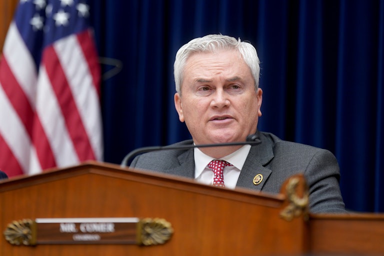 James Comer sits in front of a microphone