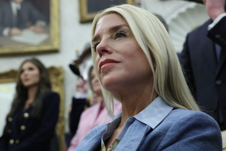 Attorney General Pam Bondi sits in the Oval Office of the White House.
