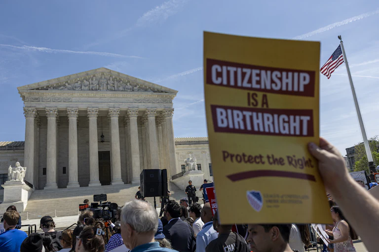 People protest in support of birthright citizenship outside the Supreme Court