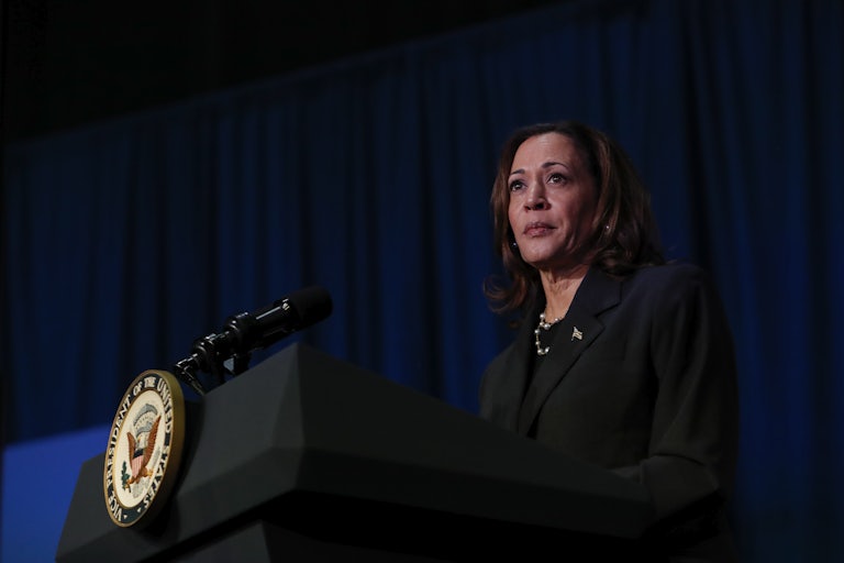 Vice President Kamala Harris stands at a podium during an event in Michigan