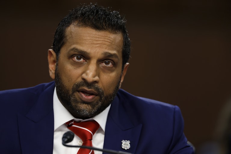 FBI Director Kash Patel speaks into a microphone during a Senate committee hearing