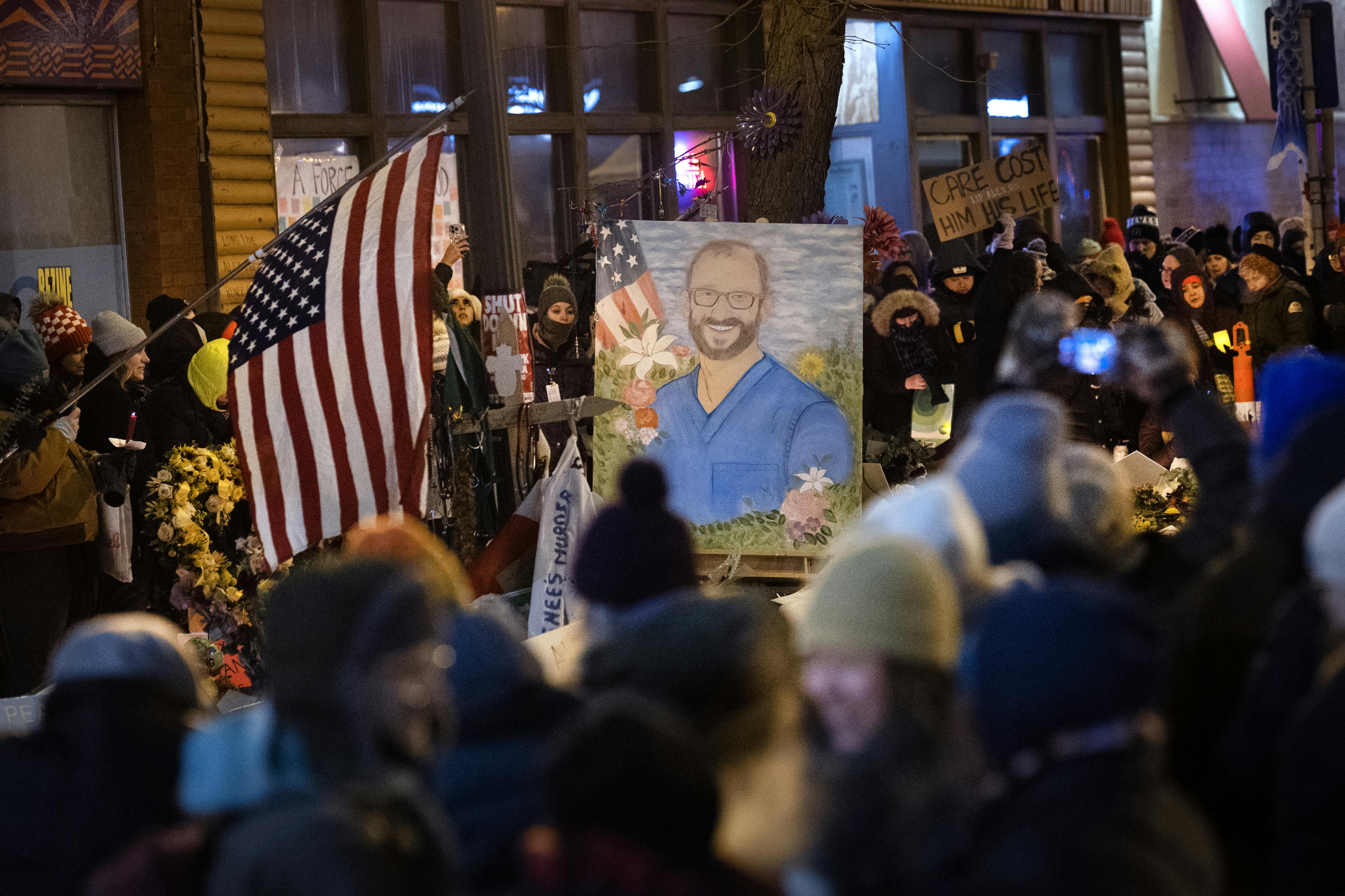 People attend a vigil for Alex Pretti in Minneapolis, Minnesota