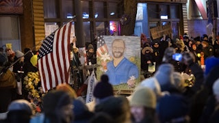 People attend a vigil for Alex Pretti in Minneapolis, Minnesota