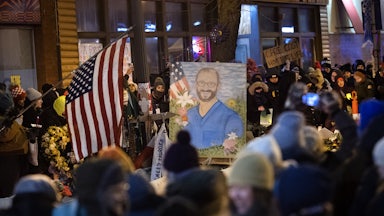 People attend a vigil for Alex Pretti in Minneapolis, Minnesota