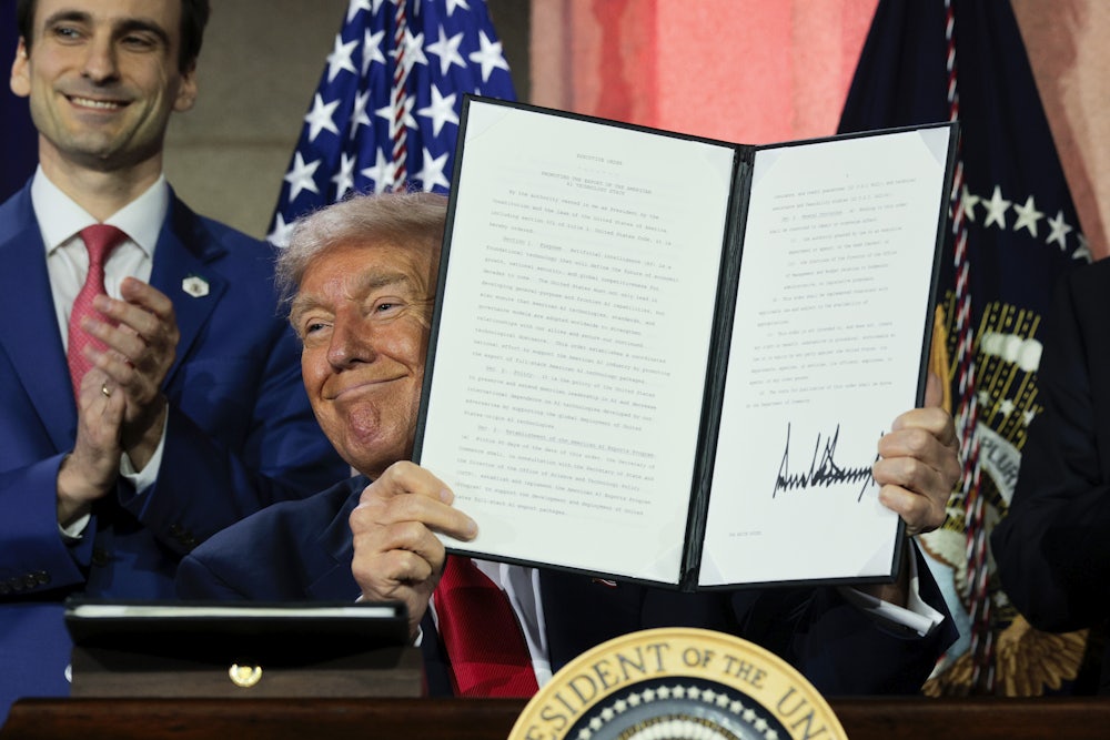 President Donald Trump displays a signed executive order during the “Winning the AI Race” summit hosted by All‑In Podcast and Hill & Valley Forum at the Andrew W. Mellon Auditorium on July 23, 2025 in Washington, D.C. Trump signed executive orders related to his Artificial Intelligence Action Plan during the event.