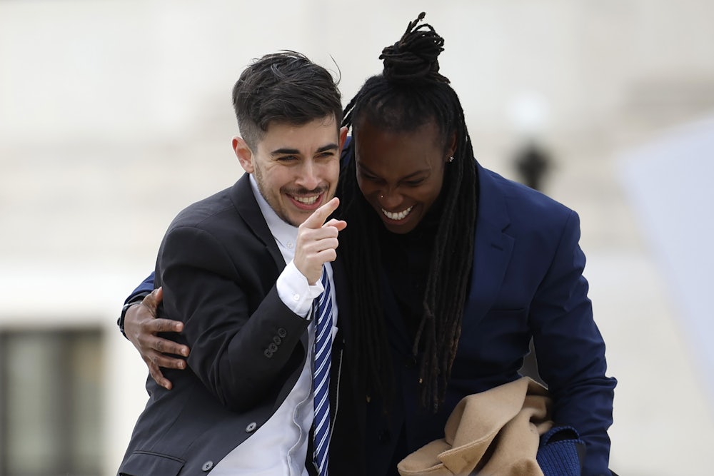 Lawyer and transgender rights activist Chase Strangio (L) and ACLU Deputy Executive Director AJ Hikes leave the Supreme Court after arguments in U.S. v. Skrmetti