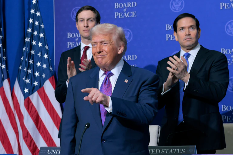 Jared Kushner and Secretary of State Marco Rubio clap as President Trump points and smiles at the inaugural meeting of the Board of Peace.