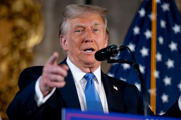 Donald Trump speaks at a podium at Mar-a-Lago