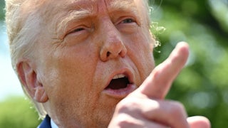 Donald Trump speaks to the media as he walks to board Marine One at the White House in Washington, D.C.