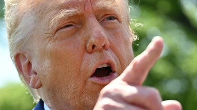 Donald Trump speaks to the media as he walks to board Marine One at the White House in Washington, D.C.