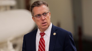 Representative Andy Ogles with his mouth open.