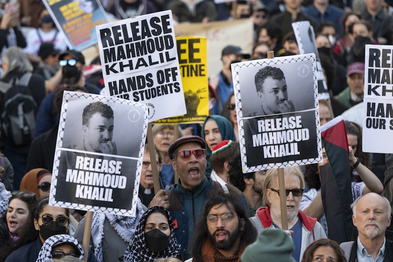 A massive crowd gathers in the street to protest the arrest of pro-Palestine activist Mahmoud Khalil.
