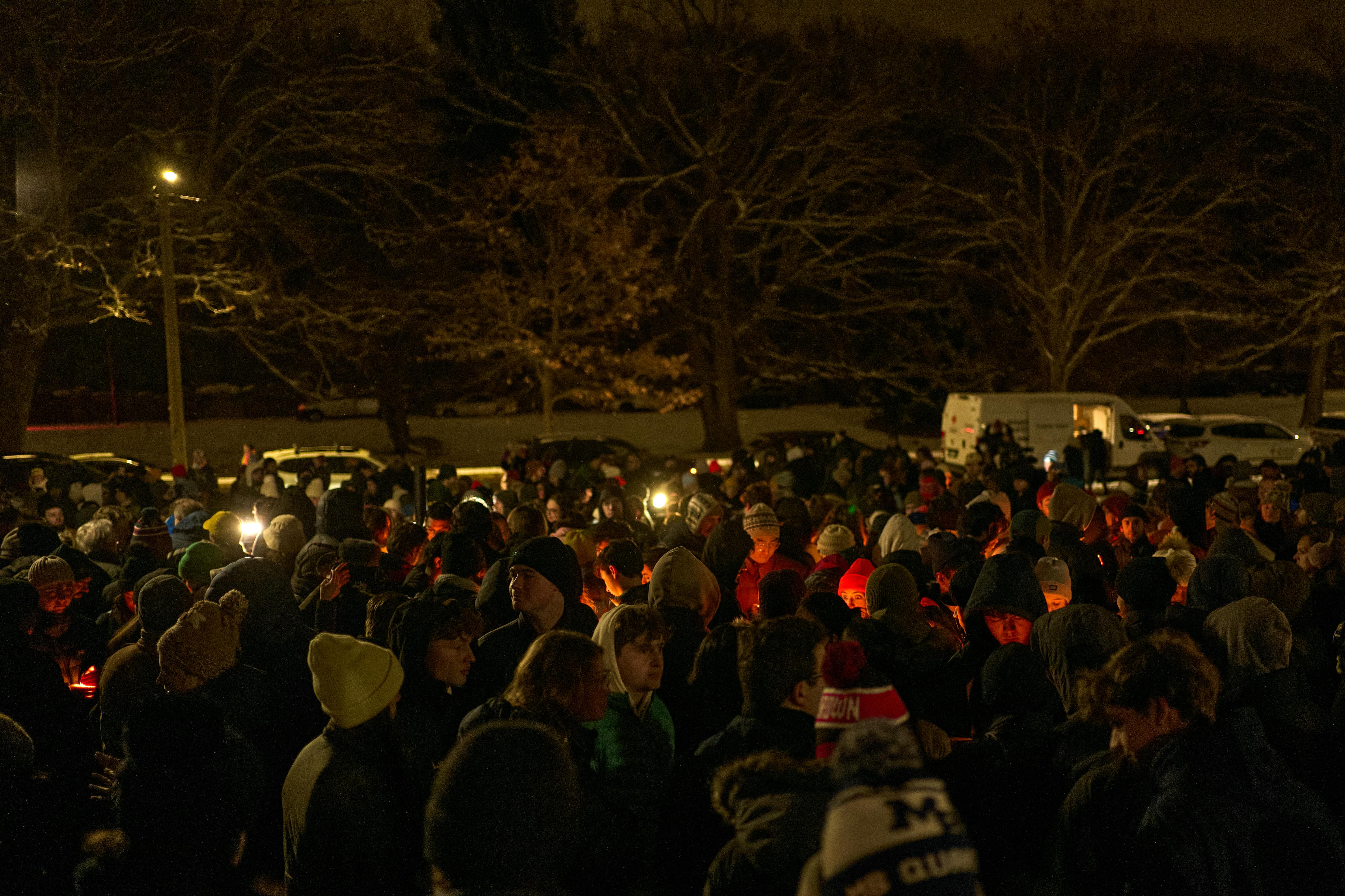 People participate in a vigil at Brown University