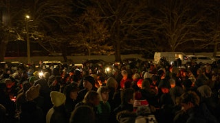 People participate in a vigil at Brown University