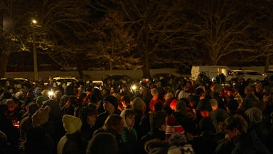 People participate in a vigil at Brown University