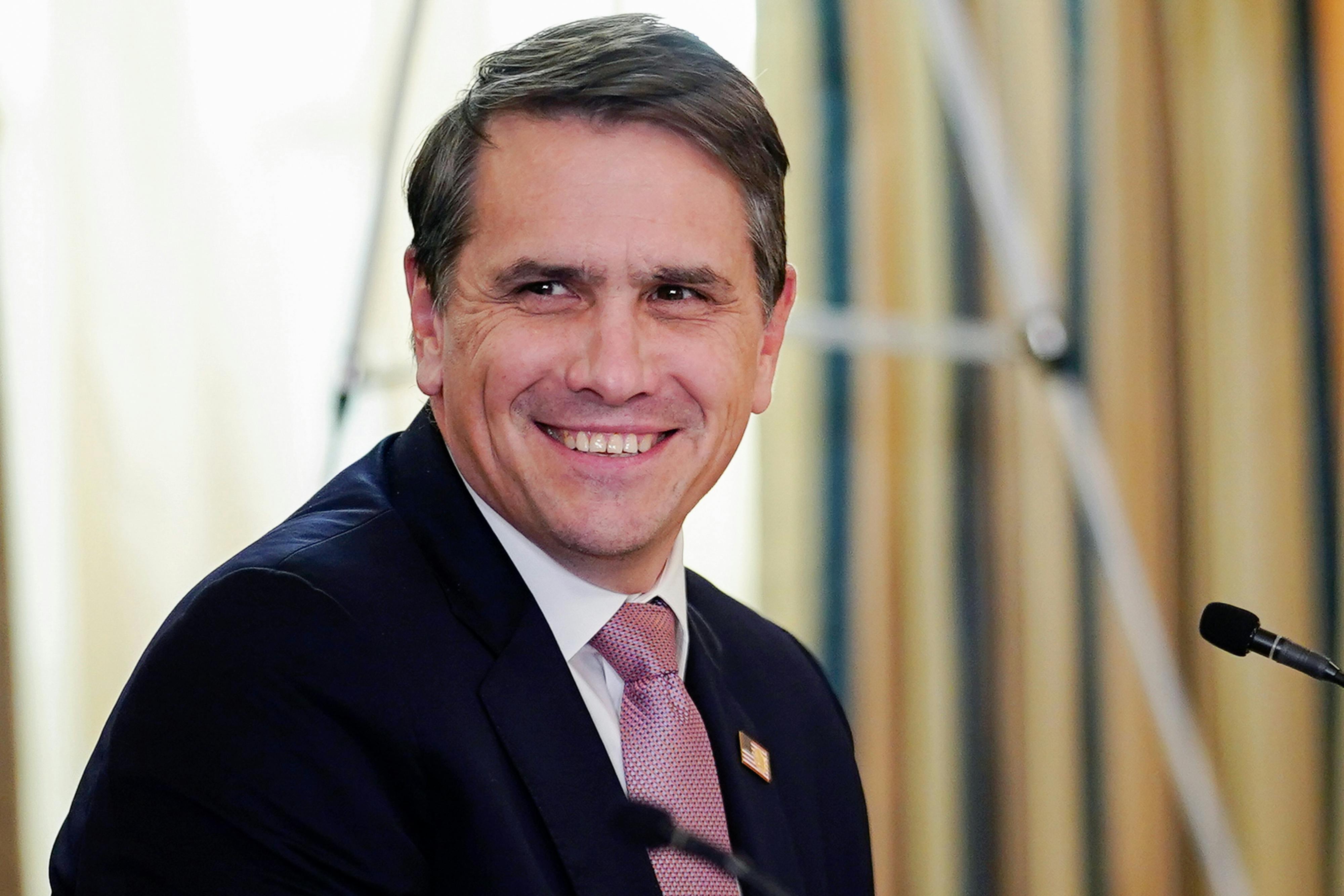 Todd Blanche looks toward the camera while smiling.