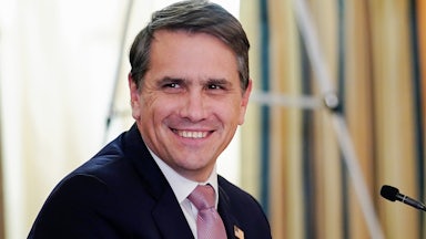 Todd Blanche looks toward the camera while smiling.