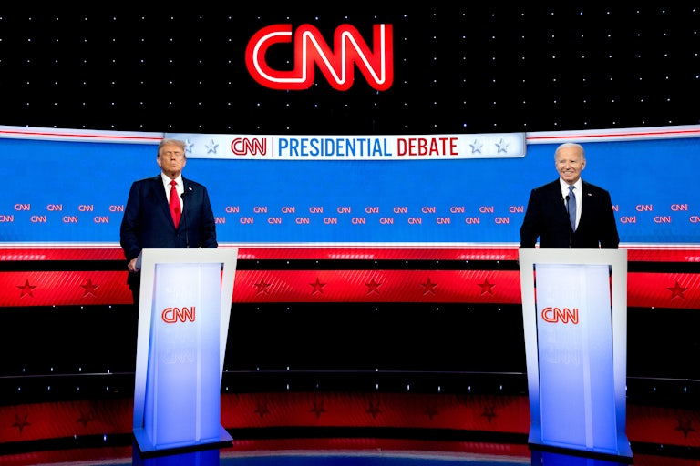 Donald Trump and Joe Biden stand on the debate stage