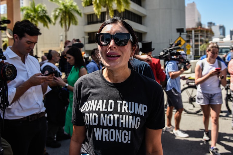 Laura Loomer, a far right troll, wears a shirt saying "Donald Trump did nothing wrong" while yelling outside a Manhattan courthouse.