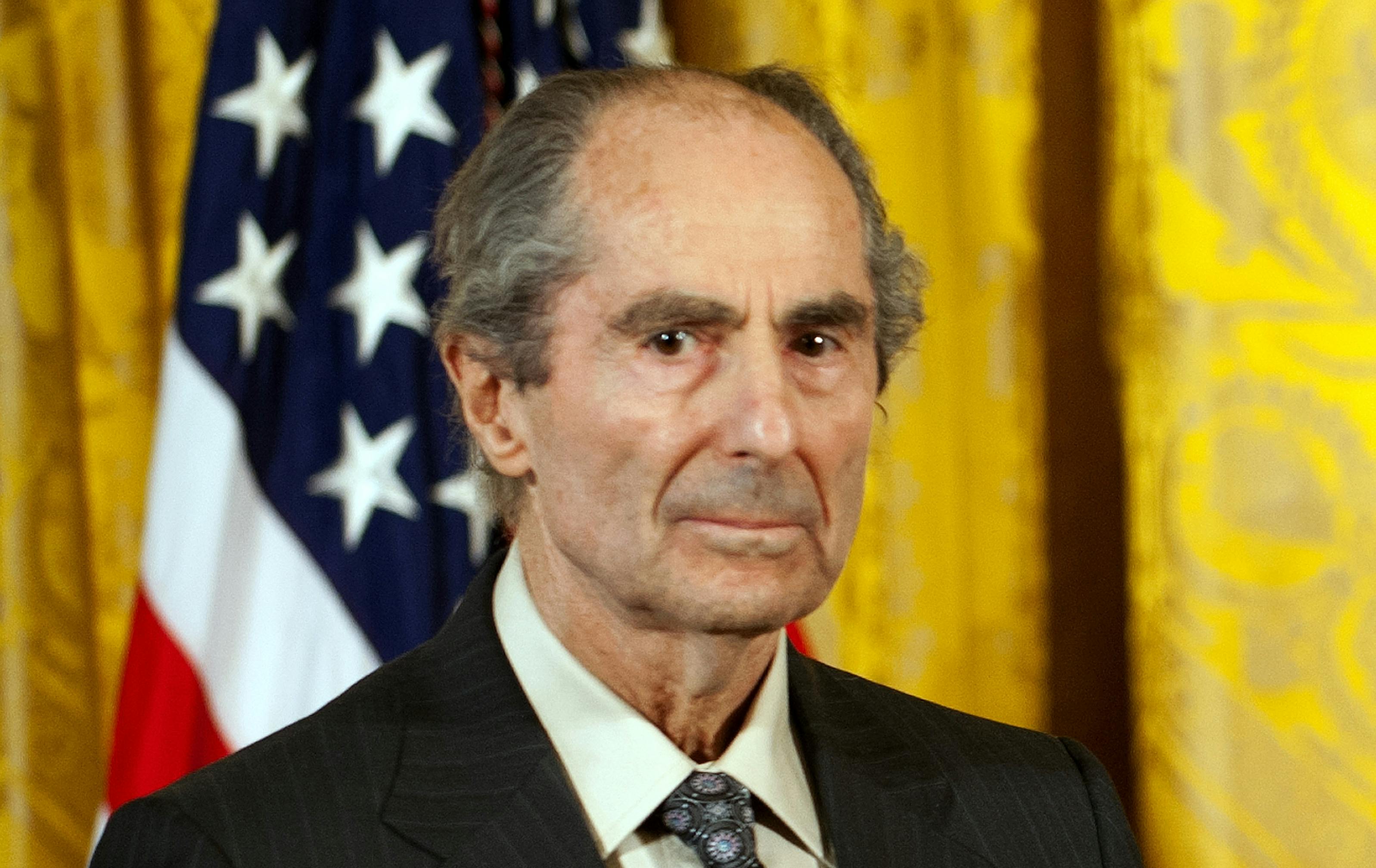 Author Philip Roth stands during an awards ceremony at the White House.