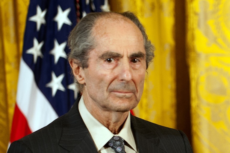 Author Philip Roth stands during an awards ceremony at the White House.