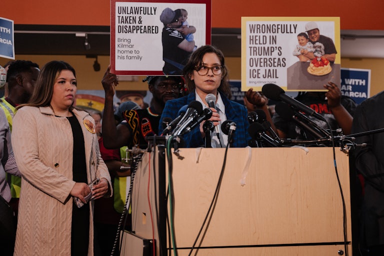 A lawyer for Kilmar Abrego Garcia speaks at a podium during a press conference and rally in support of bringing him back from El Salvador