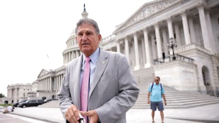 West Virginia Senator Joe Manchin stands on the steps of the U.S. Capitol.