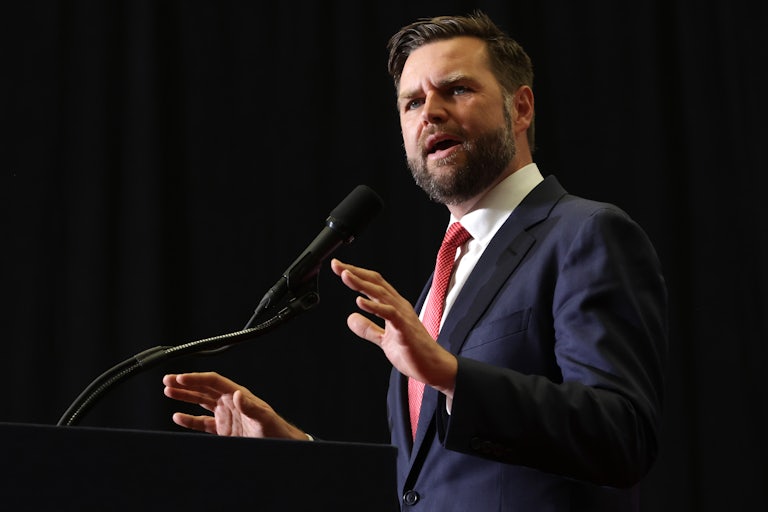 J.D. Vance gestures as he speaks at a Donald Trump rally