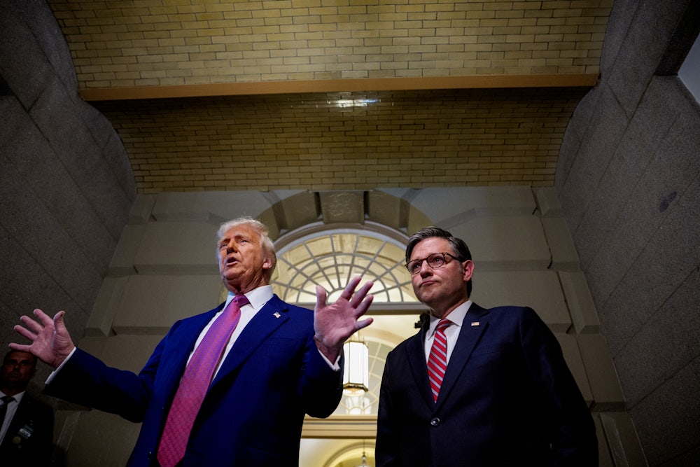 Donald Trump and House Speaker Mike Johnson speak to members of the media as they depart a House Republican meeting at the U.S. Capitol.