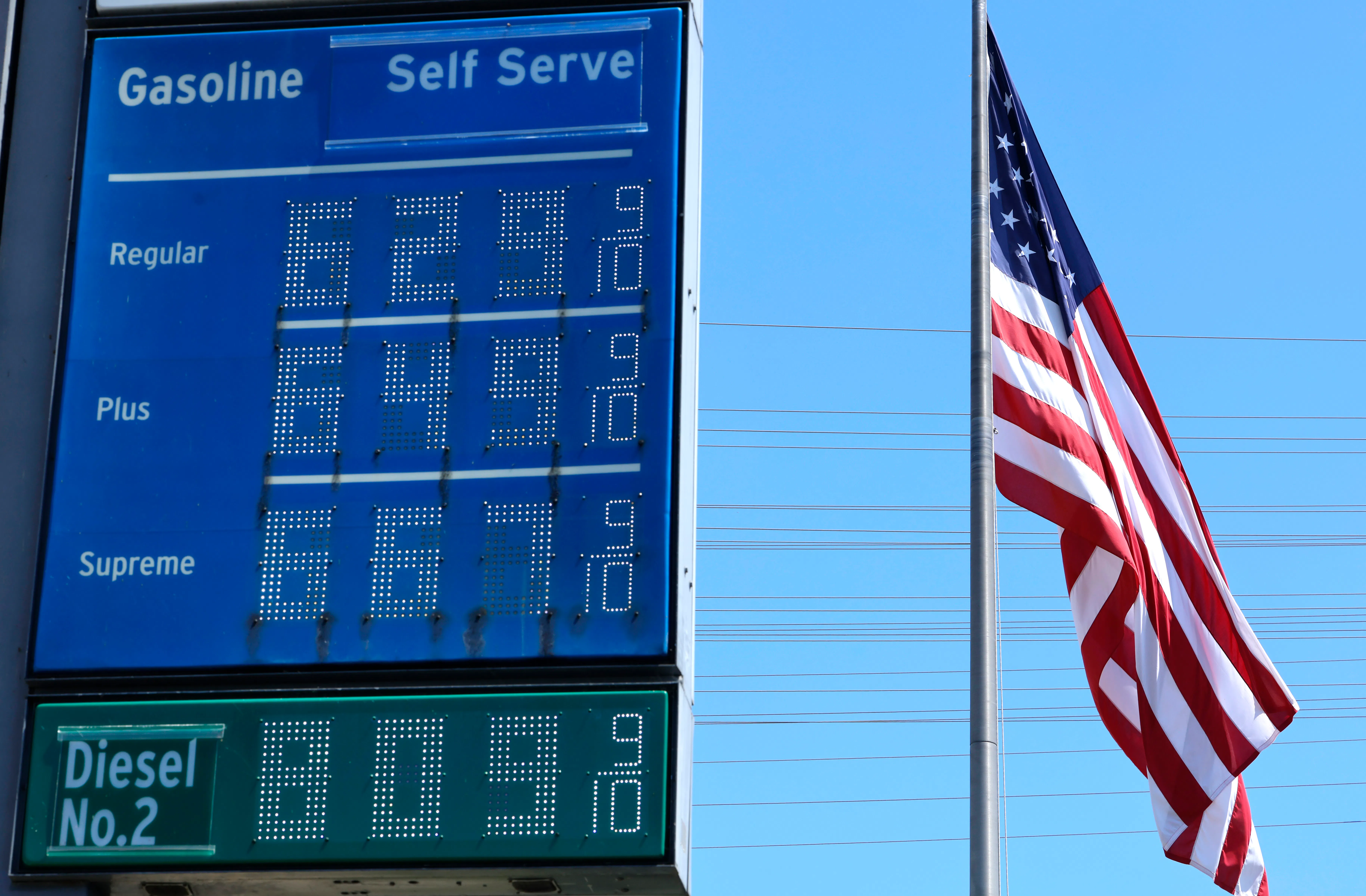 High gas prices are displayed at a Chevron gas station (6.29 for regular)