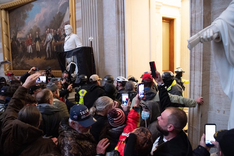 Donald Trump supporters run through the U.S. Capitol during the January 6 attack
