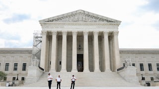 A shot of the Supreme Court building in daylight.