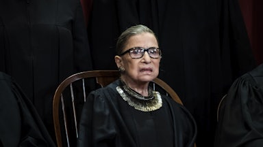 A close-up of Justice Ruth Bader Ginsburg, posing for her official Supreme Court portrait.
