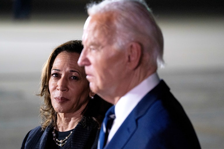 Kamala Harris watches Joe Biden speak to reporters after the Russian prisoner exchange