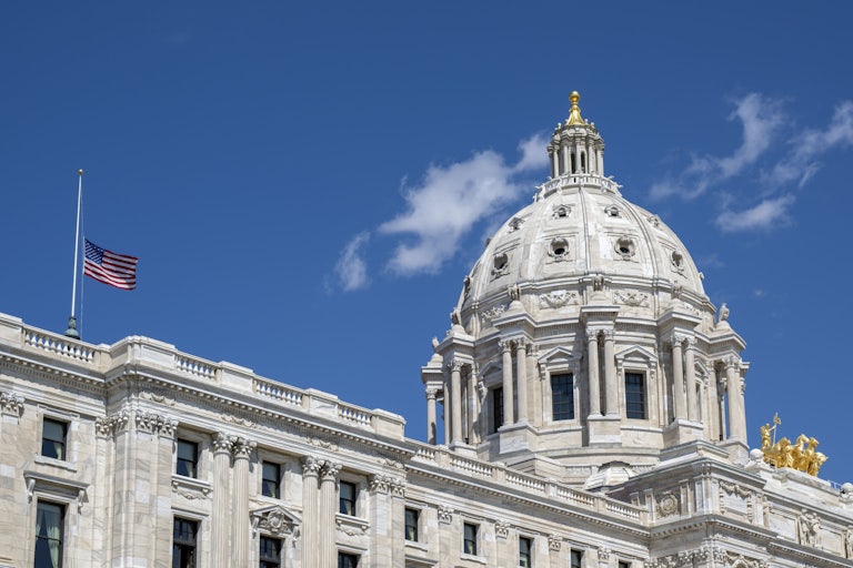 A flag flies half-mast at the Minnesota state Capitol.