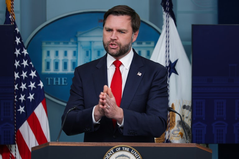 JD Vance speaks at the podium in the White House press briefing room.