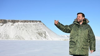 JD Vance waves while wearing a giant coat on his trip to Greenland.