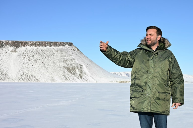 JD Vance waves while wearing a giant coat on his trip to Greenland.